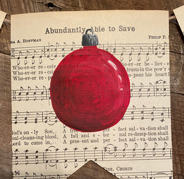 Joy banner with red Christmas ornament