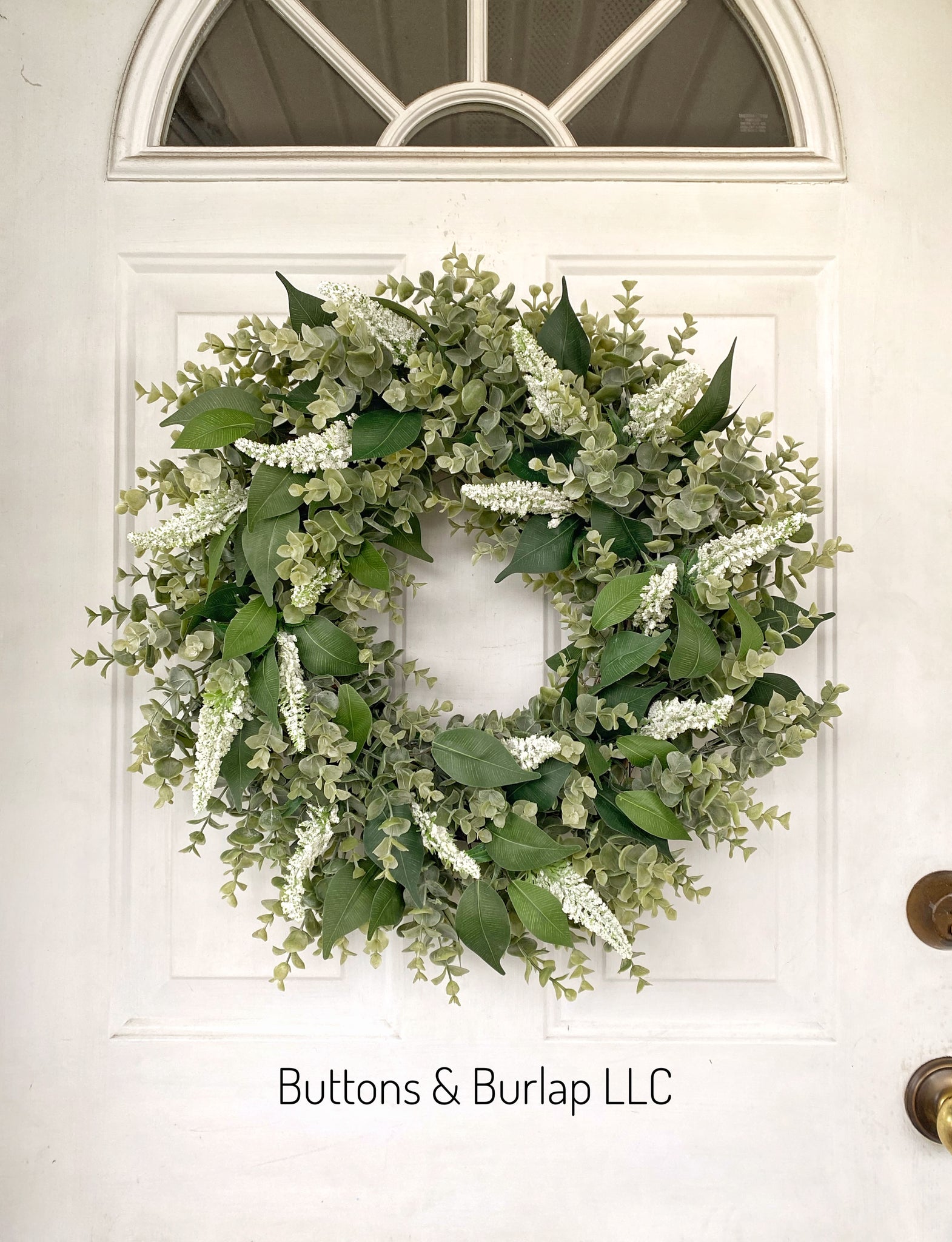 Greenery wreath with white seeded stems