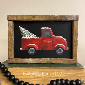 Red truck & snowy Christmas tree