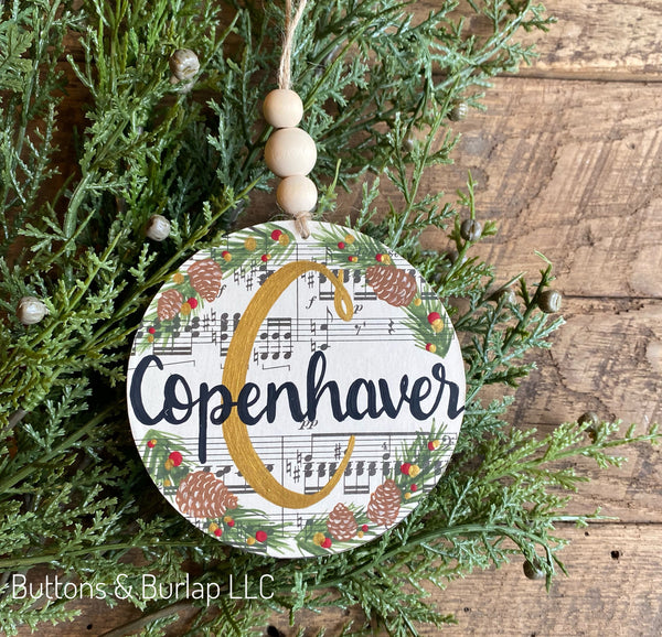 Personalized family name beaded wood ornament