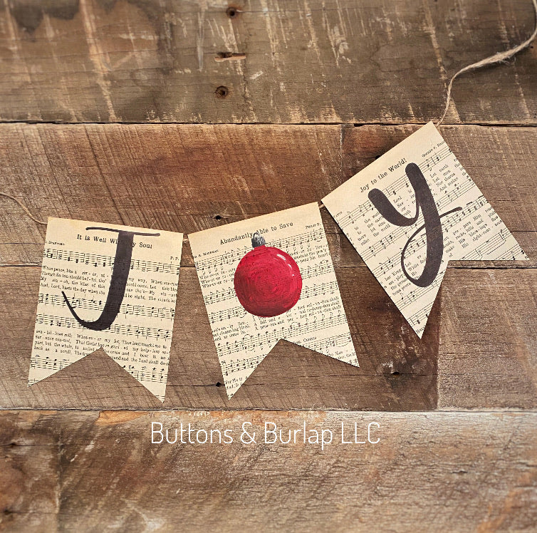 Joy banner with red Christmas ornament